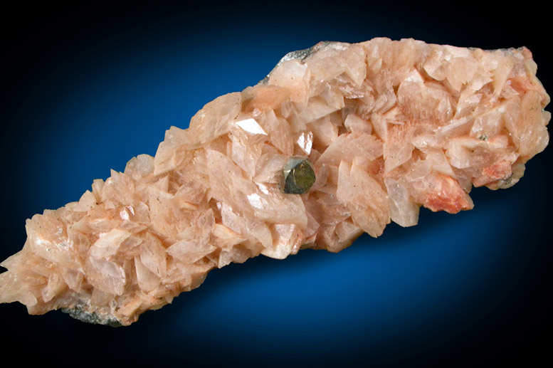 Pyrite crystal 2 mm across on orthoclase crystals to 3 mm from dumped rock in N.J. meadowlands 