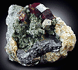 Mineral specimen: Grossular Garnet, Diopside, Sphalerite, Vesuvianit from Goodall Quarry, Sanford, Maine.